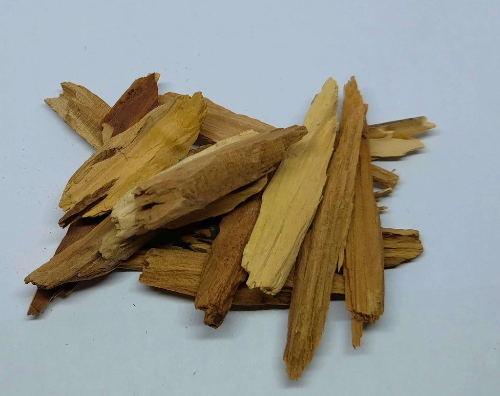 Stack of dried wood sticks on a white background